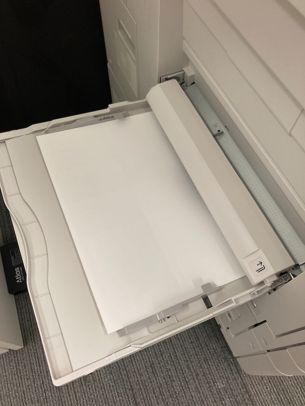 Printer bypass tray with paper loaded